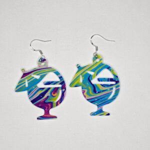 Colorful swirled acrylic tropical drink earrings with umbrella design on white background.