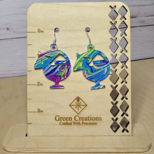 Colorful tropical cocktail glass earrings on a wooden Green Creations display stand.